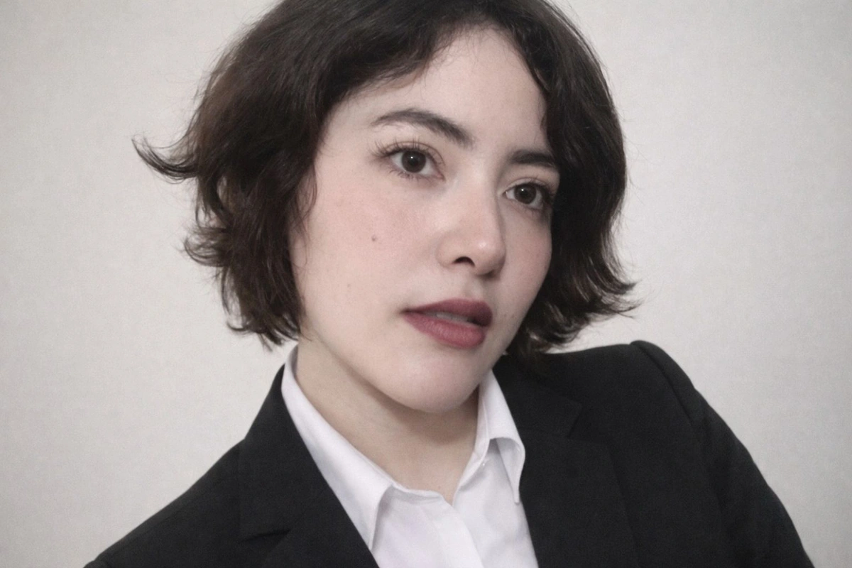 Karen Avila in a black blazer and white shirt